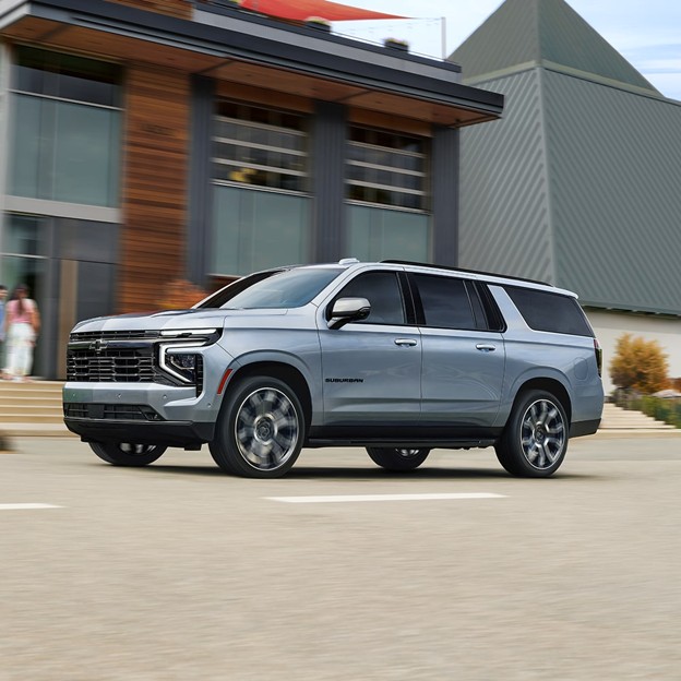 2026 Chevrolet Suburban full-size SUV shown driving on a paved road